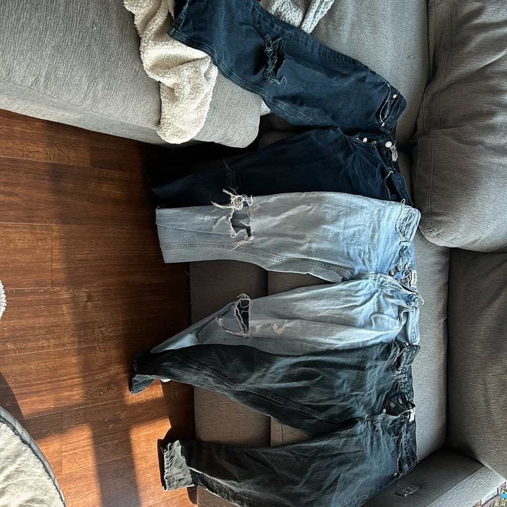 Three agolde straight cut high waisted jeans.